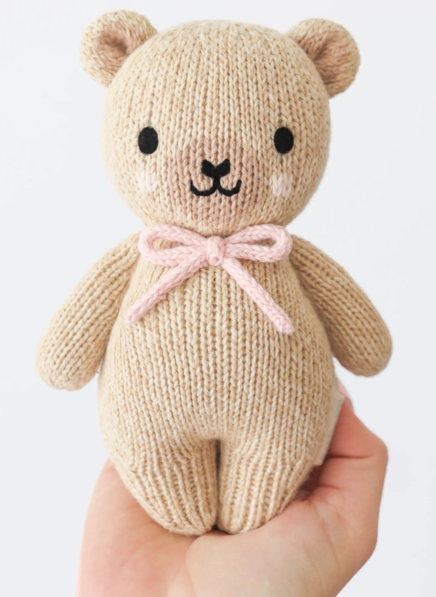 Cuddle&Kind Cuddle + Kind Baby Honey Bear - Blush Bow available at The Good Life Boutique