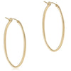 Pair of oval gold 2-inch textured hoop earrings with post closure on white background