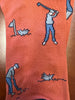 Coral orange knit socks with blue and white nautical themed pattern featuring sailors and boats