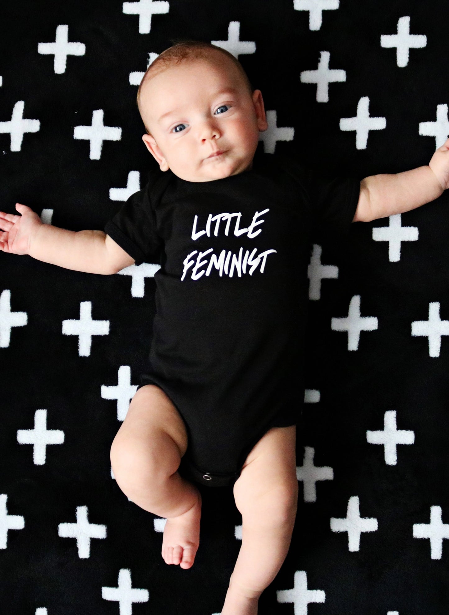 Love Bubby Little Feminist Short Sleeve Black Baby Bodysuit available at The Good Life Boutique