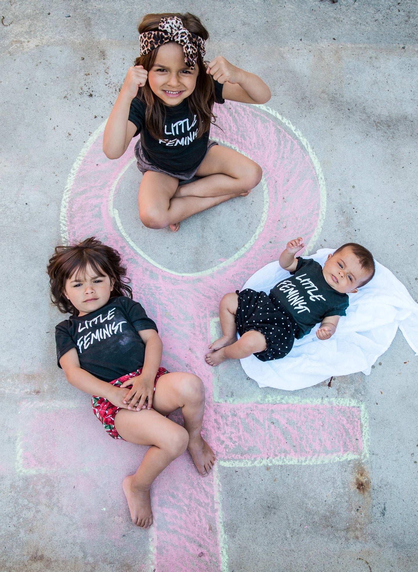 Love Bubby Little Feminist Short Sleeve Black Baby Bodysuit available at The Good Life Boutique