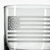 Close-up of clear whiskey glass with etched Betsy Ross flag design featuring 13 stars in circle and 250 text