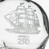Close-up detail of etched tall ship design on clear glass whiskey decanter