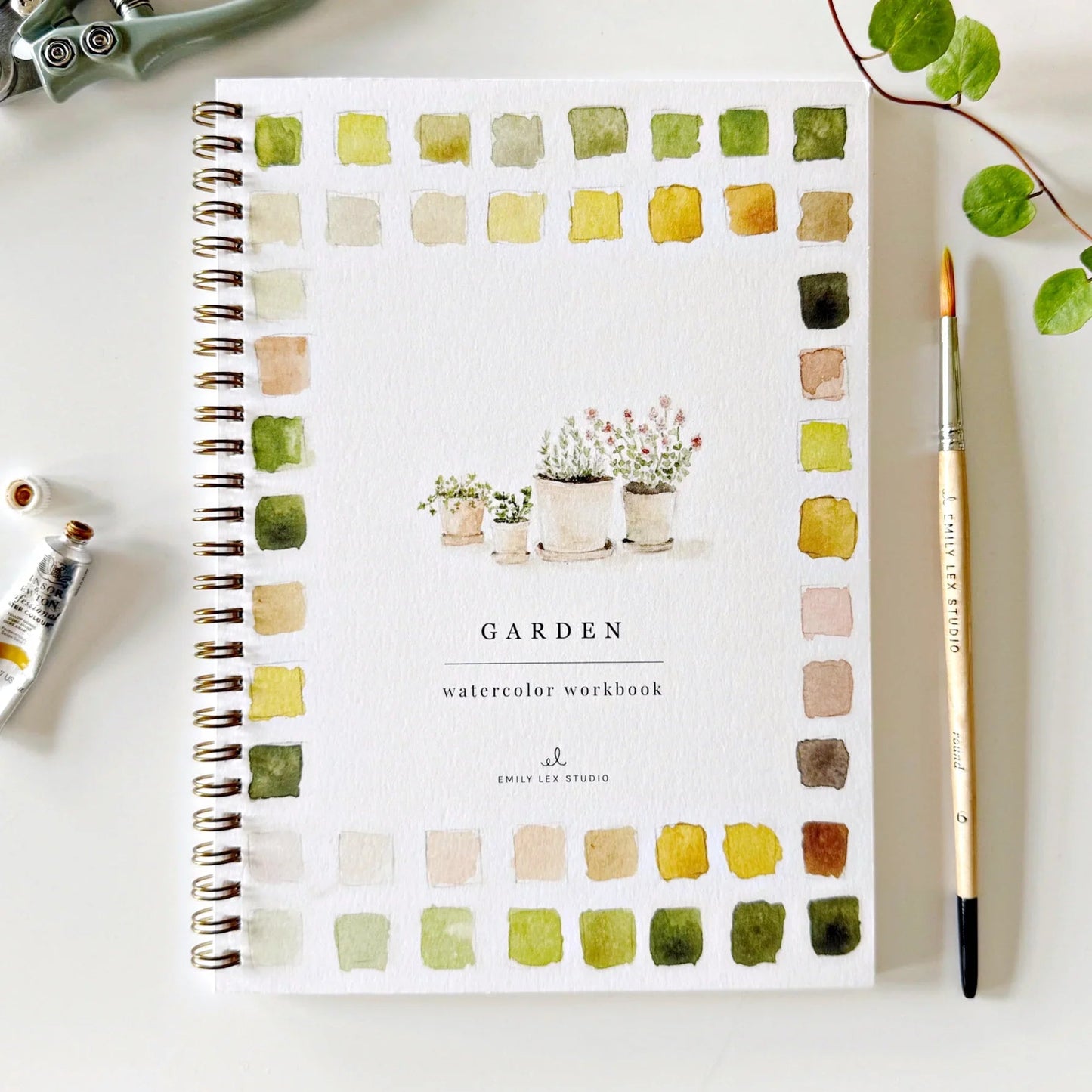 Garden Watercolor Workbook by Emily Lex Studio with color swatches and paintbrush