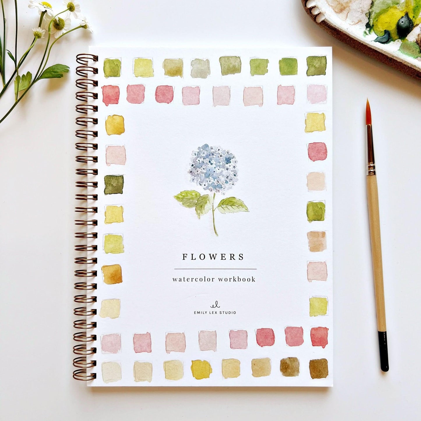 Flowers Watercolor Workbook by Emily Lex Studio with color swatches and paintbrush