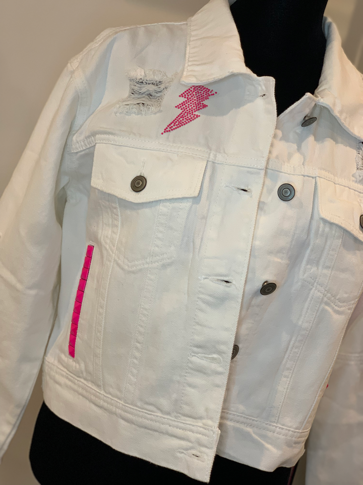 Moving Forward Designs Moving Forward Pink Bolt and Stud White Denim Jacket available at The Good Life Boutique